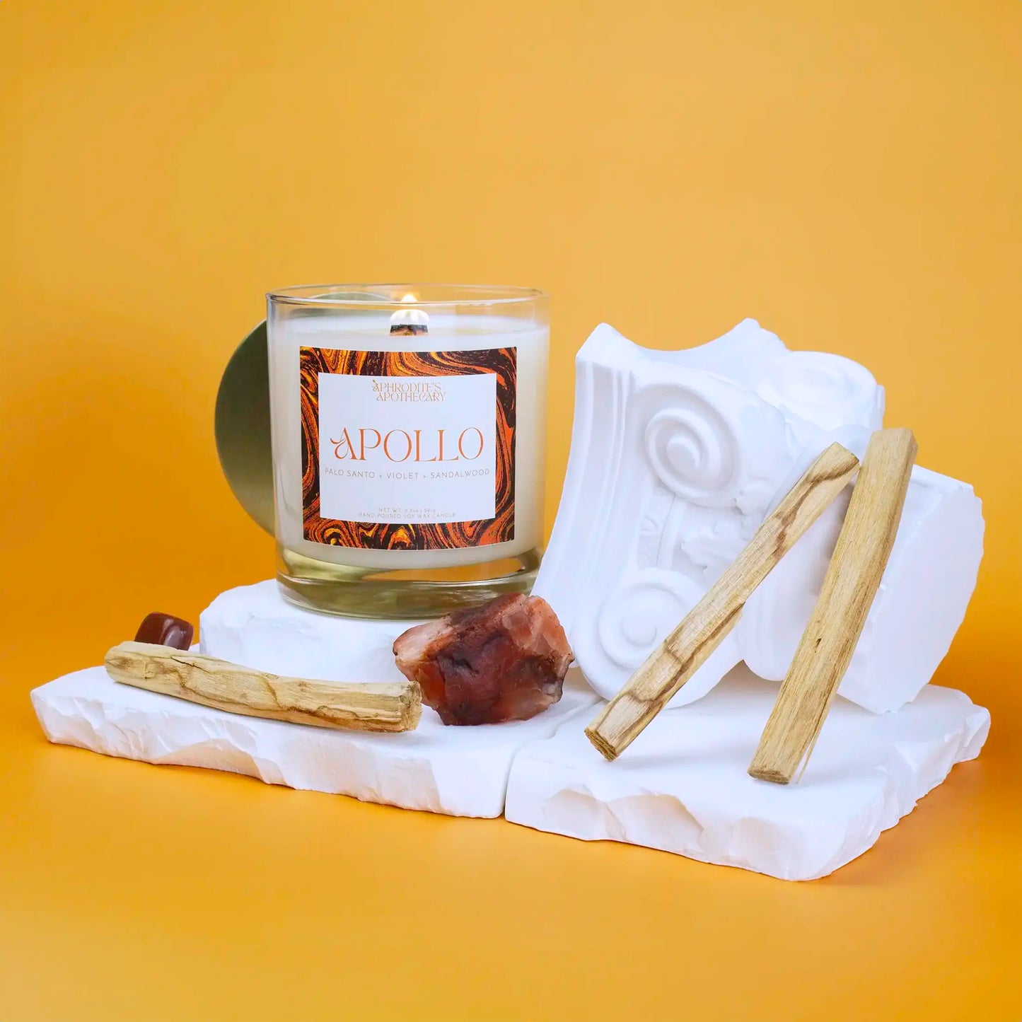 Aphrodite Candle 8.5oz on a Greek themed photo set with bright background