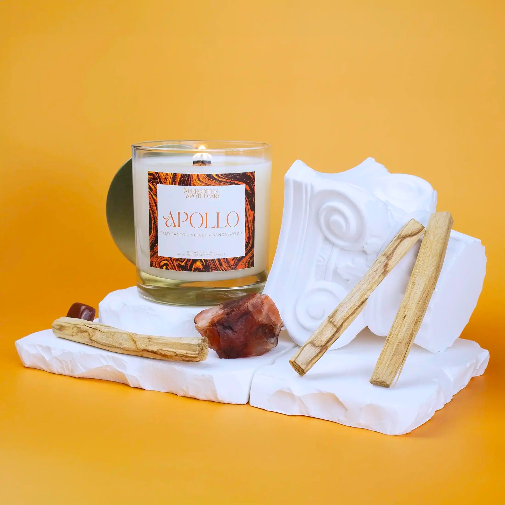 Aphrodite Candle 8.5oz on a Greek themed photo set with bright background
