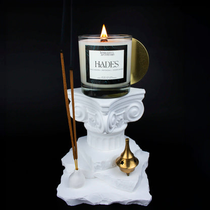 Hades Candle 8.5 oz on a Greek themed photo set with nag champa incense sticks and smoke swirling about